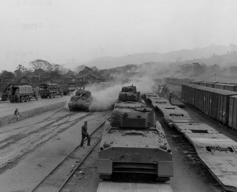 M4_sherman_tanks_on_railroad_flat_cars_ledo_Burma_1945.jpg