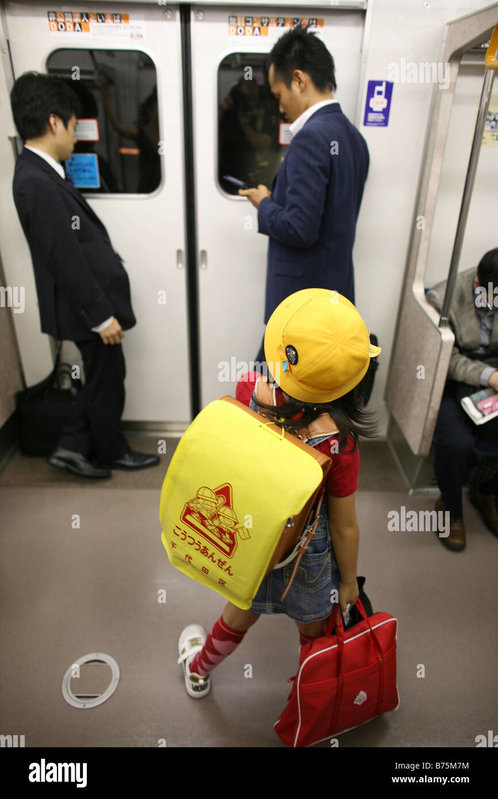 japanese-student-on-her-way-to-school-in-the-metro-of-tokyo-japan-B75M7M.jpg